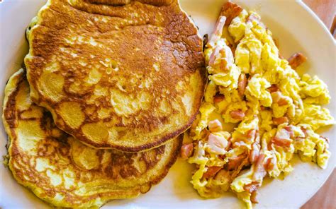 Breakfast Scrambled Eggs With Pancake Pancakes Nicely Arranged On Plate