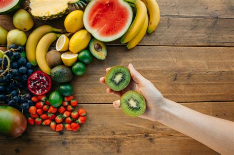 close  shot  assorted fruits   wooden surface  stock photo