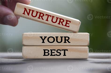 Hand Holding Wooden Block With Text Nurture Your Best Motivational