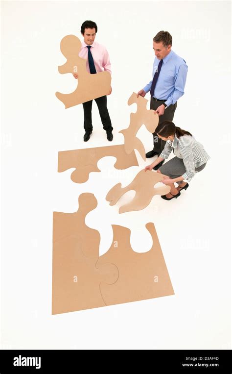 Business People Assembling Puzzle Stock Photo Alamy