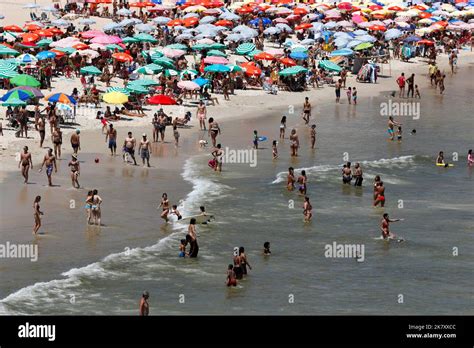 Leblon beach, Rio de Janeiro, Brazil. People sunbathing near shore with ...