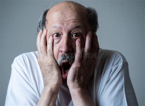 Close Up of Scared and Shocked Senior Man Gesturing in Fear with Hands and Face Stock Photo ...