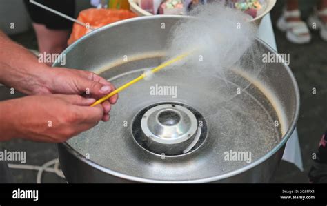 The process of making cotton candy on the street Stock Photo - Alamy