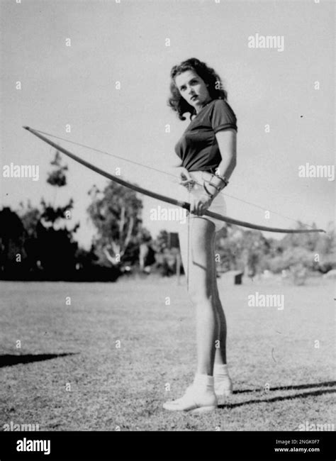 Actress Jane Russell Tests Her Skill With A Bow And Arrow July 25