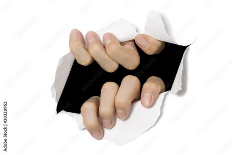 Hands Tearing Through White Paper Break Out Stock Photo Adobe Stock