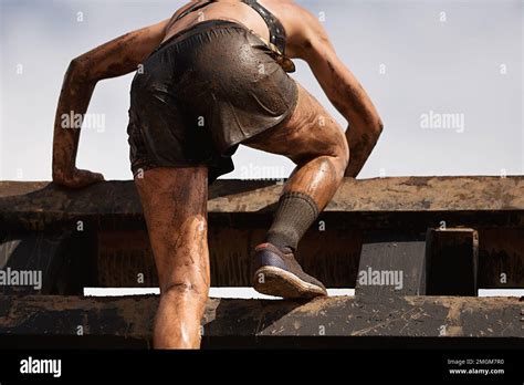 Mud Race Runners View Of The Participant For Overcoming Hurdles Stock