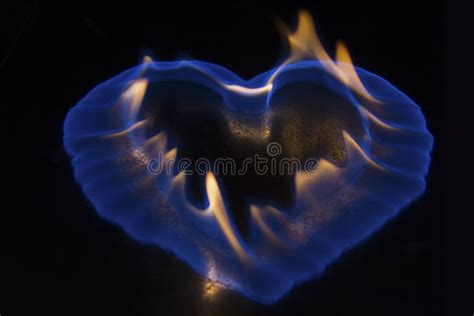 Blue Flame In The Shape Of Heart Burning On Shiny Surface Stock Image