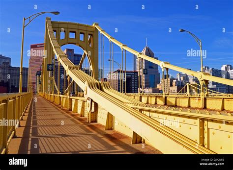 The Yellow Sixth Street Bridge Leads Pedestrians And Drivers To