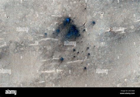 Martian impact craters. Mars Reconnaissance Orbiter (MRO) image of a cluster of small impact ...