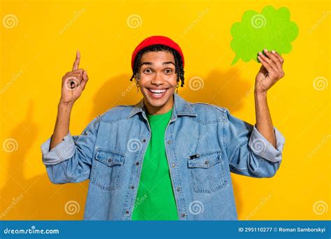 Photo Of Excited Funky Man Wear Jeans Shirt Red Hat Pointing Finger Holding Speaking Bubble