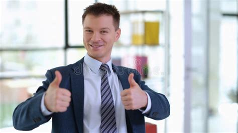 Successful Businessman in Suit Showing Thumbs Up in Office Stock Photo ...