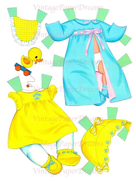 The Paper Doll Is Wearing A Yellow Dress And Rubber Ducky Shoes Which Are Also Made Out Of