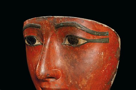 AN EGYPTIAN POLYCHROME WOOD MUMMY MASK LATE NEW KINGDOM TO THIRD