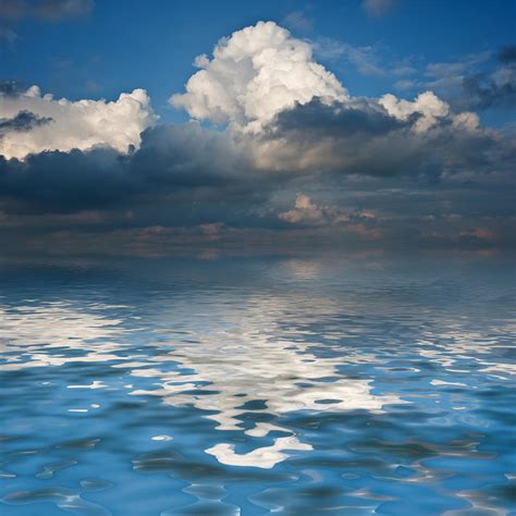 Beautiful Sky Reflected In Calm Sea Waters Photograph By Matthew Gibson