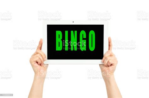 Hands Holding Tablet With The Word Bingo Stock Photo Download Image