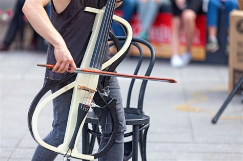 Premium Photo | Musician playing with his electric cello