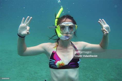 Girl Snorkeling In Bartolomé Island Galapagos High-Res Stock Photo - Getty Images