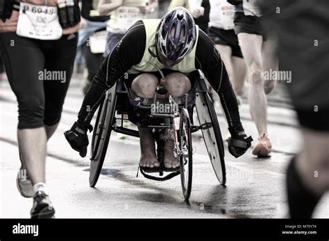 Handicapped Person In A Wheelchair Participates In Marathon Among