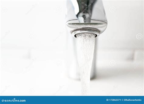 Close Up Water Flowing From The Tap Horizontal Detail Modern Bathroom