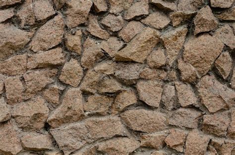 Un Muro De Piedra Salvaje De Forma Irregular Foto Premium