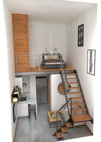 The Stairs Lead Up To An Open Kitchen And Dining Area In This Small