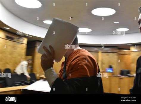 Nypd Officer Hariton Marachilian Covers His Face With Documents As He