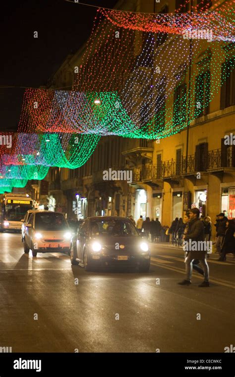 A Night time View of the streets of Rome Italy streets lite up with the colors of the Italian ...