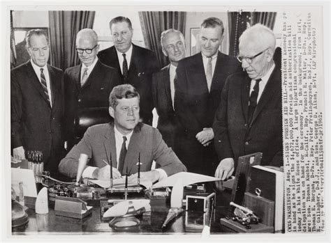 President John F Kennedy Signing A Bill In The White House Office