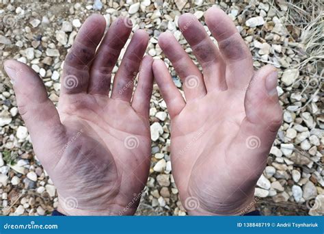 The Dirty Hands Of The Worker On The Construction Site Stock Image