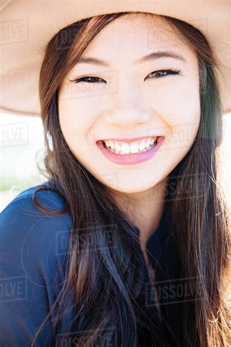 Chinese Woman Smiling Outdoors Stock Photo Dissolve