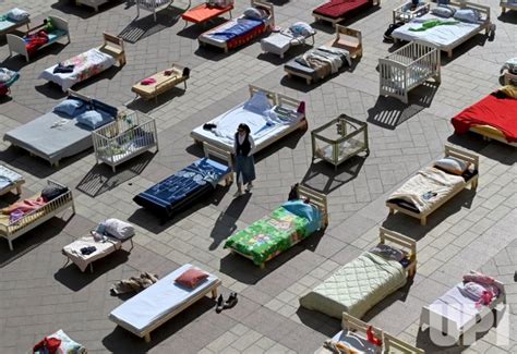 Photo An Installation Empty Beds For The Israeli Hostages Held By