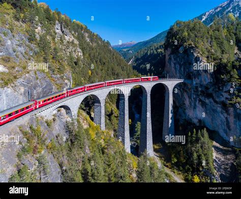 Landwasser Viaduct with train and locomotive, railway bridge near Filisur, landmark of the ...