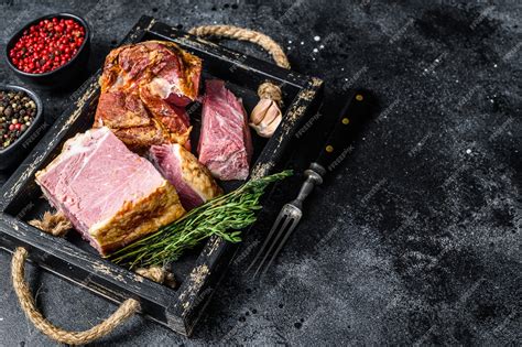 Premium Photo Smoked Sliced Pork Slab Bacon Meat In A Wooden Tray Black Background Top View