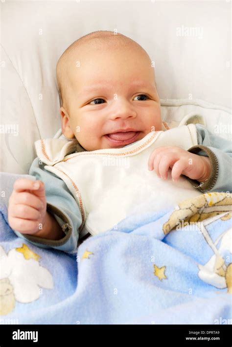 Newborn baby boy smiling Stock Photo - Alamy