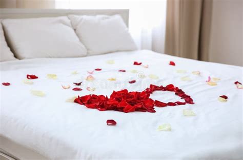 Rose petals on bed stock image. Image of pillow, love - 111525989