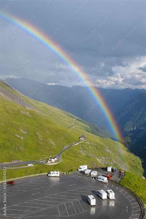 Rainbow Over Mountain Landscape With Car Park At Kaiser Franz Josefs