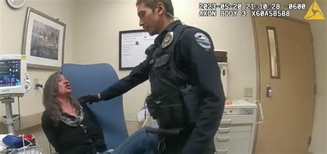 Officer Caught On Camera Striking Handcuffed Woman In Face