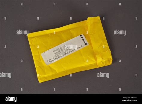 A Yellow Mail Bag That Says Return To Sender Undelivered Package On A