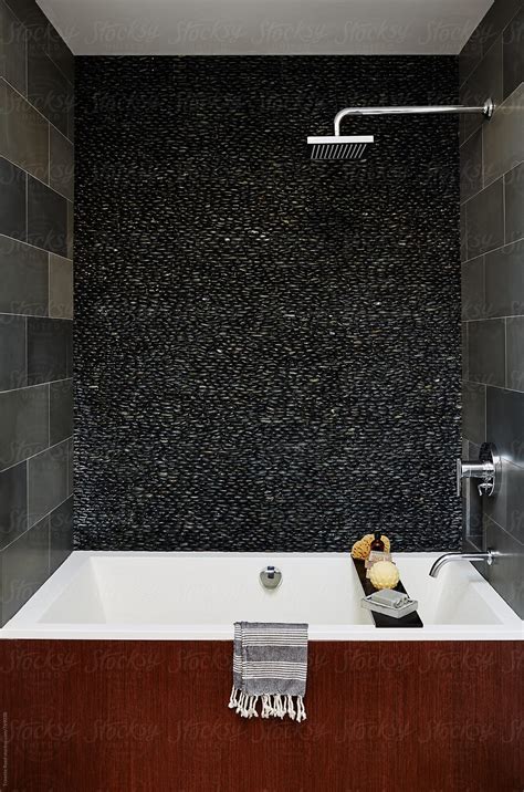 Modern Design Soaking Bathtub In Bathroom Pebble Tile By Stocksy