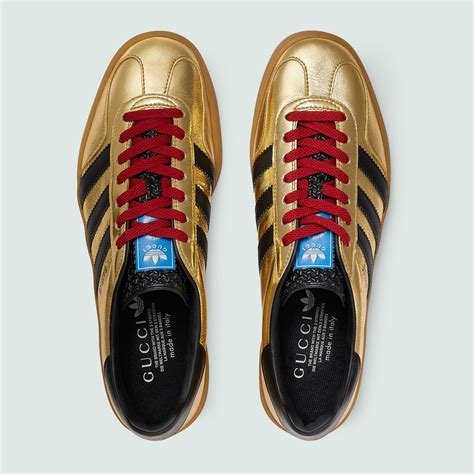 adidas x Gucci men's Gazelle sneaker in metallic gold leather | GUCCI® US