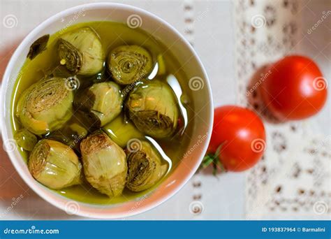 Italian Food Pickled Drilled Artichokes Hearts In Olive Oil Stock