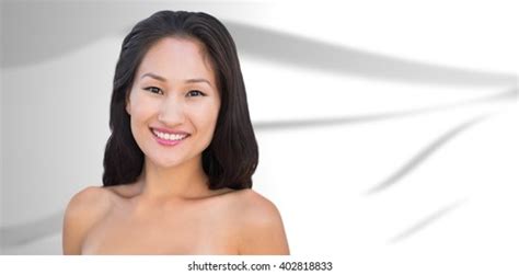 Smiling Sensual Nude Brunette Posing Against Stock Photo