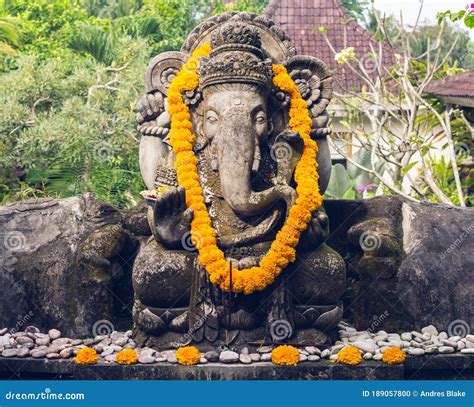 Ganesha Statue With Offerings On The Island Of Bali In Indonesia Stock