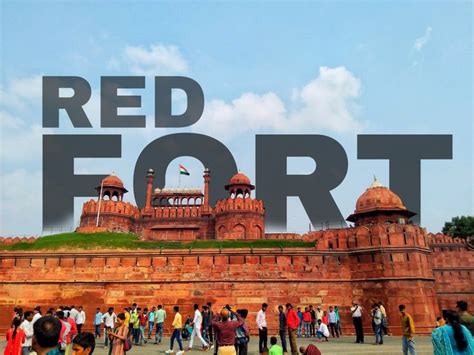 people walking around in front of a red fort with the words red fort ...