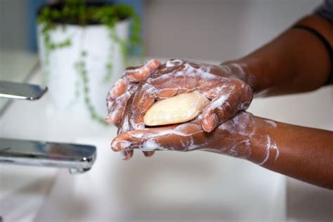 Close Up Of Black African Australian Woman Washing Hands With A Bar Of