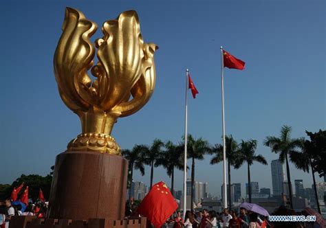 People Attend National Flag Raising Ceremony At Golden Bauhinia Square