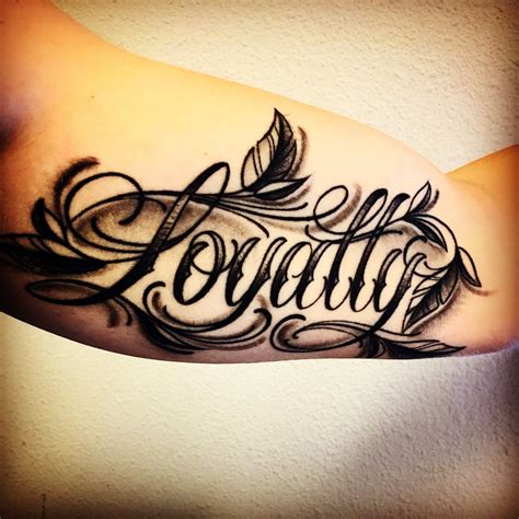 last name forearm tattoo 8