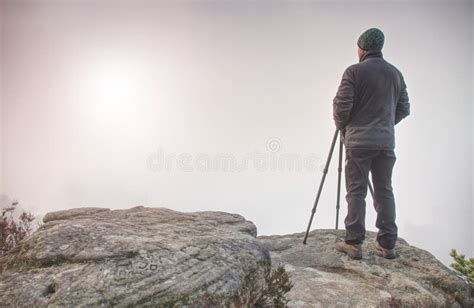 Man Hiker Stay On Mountain Summit For Taking Photo With Dslr Camera