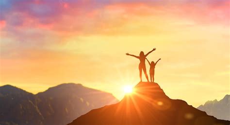 Premium Photo Mother And Daughter Meet Dawn At Peak In Mountains