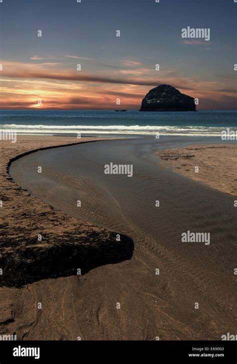 Trebarwith Strand Near Tintagel Cornwall With Gull Rock In Silhouette